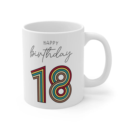 close up of a white mug with 18 happy birthday wrote on it